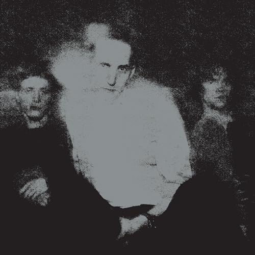 Grainy black and white photo of three obscured faces.