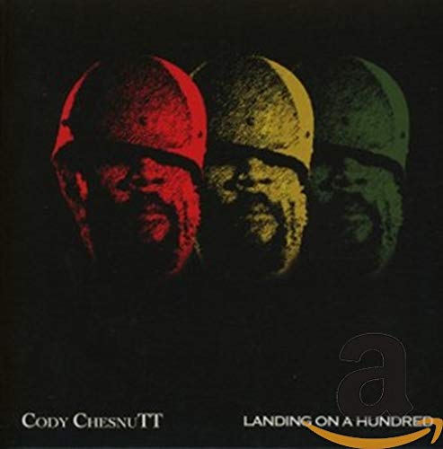 CD cover for Cody Chesnutt’s “Landing On A Hundred” with three helmeted faces.