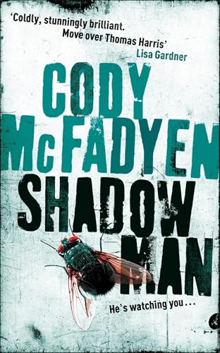 Book cover: “Shadow Man” with teal text and a large fly image.