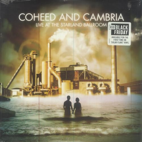 Vinyl cover showing two silhouettes standing in water before an industrial factory.