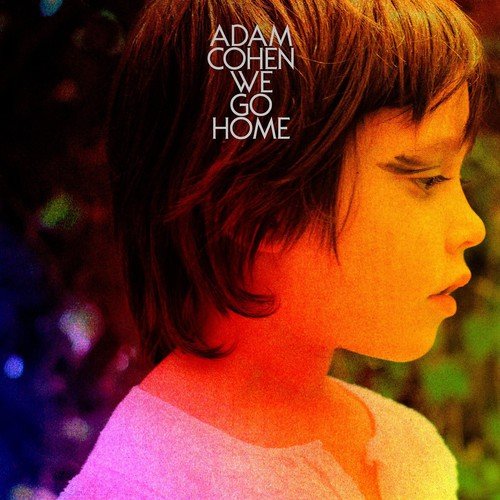 "Album cover featuring a young boy with short hair, eyes closed, outdoors."