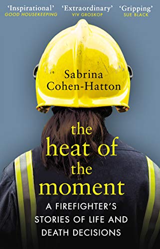 A firefighter wearing a yellow helmet and dark uniform, viewed from behind.