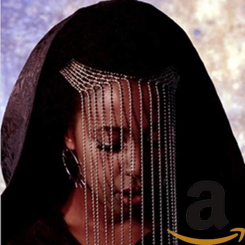 Woman with beaded fringe covering face, album cover for "Fool's Paradise.