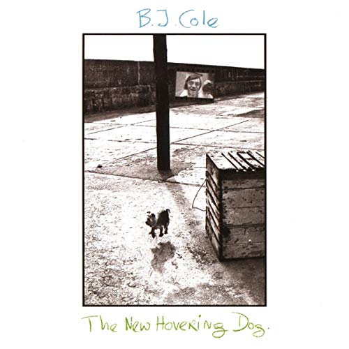 Black and white album cover featuring a small dog and a projected image.