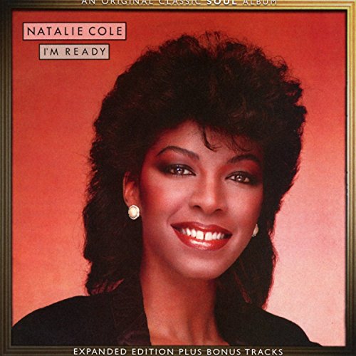 Natalie Cole smiling on the cover of her I'm Ready album against red background.