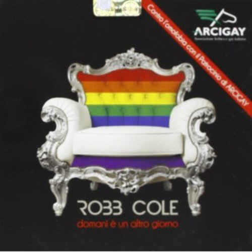CD cover with ornate white chair featuring rainbow stripes.