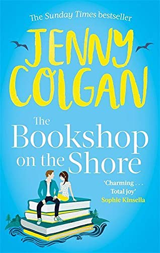 Book cover with a man and woman sitting on a stack of books.