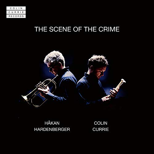 CD cover featuring two men playing trumpets in low light.