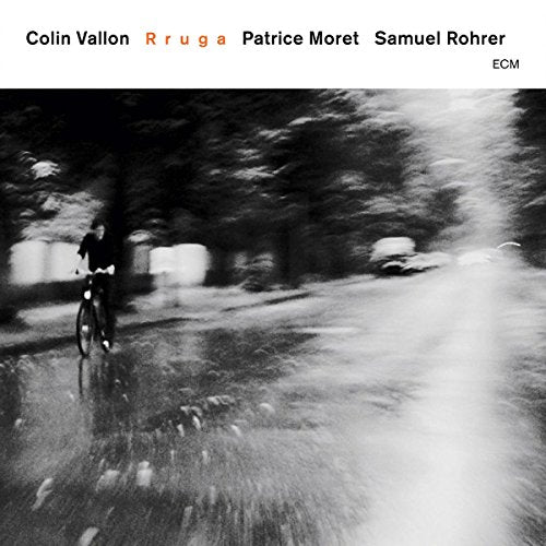 CD cover for Colin Vallon Trio’s “Rruga” featuring a blurred cyclist.