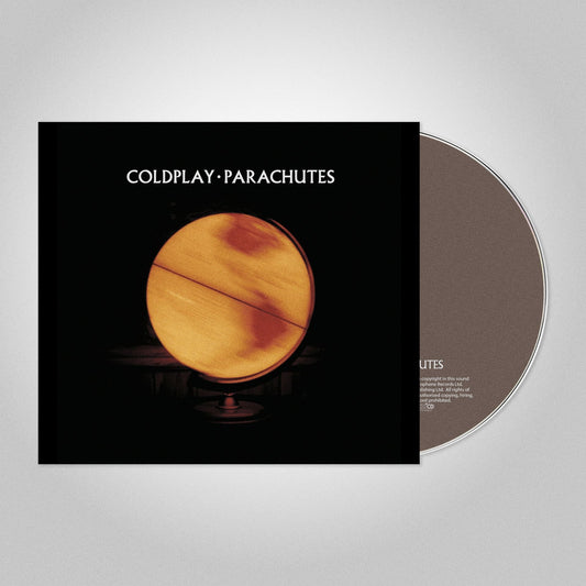 Coldplay’s “Parachutes” CD with a golden circle on a black cover.