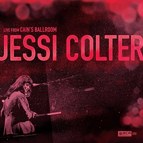 "Album cover with red tinted image of Jessi Colter performing on stage with guitar."