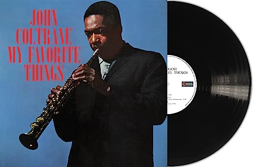 John Coltrane album cover with saxophone and vinyl record shown.
