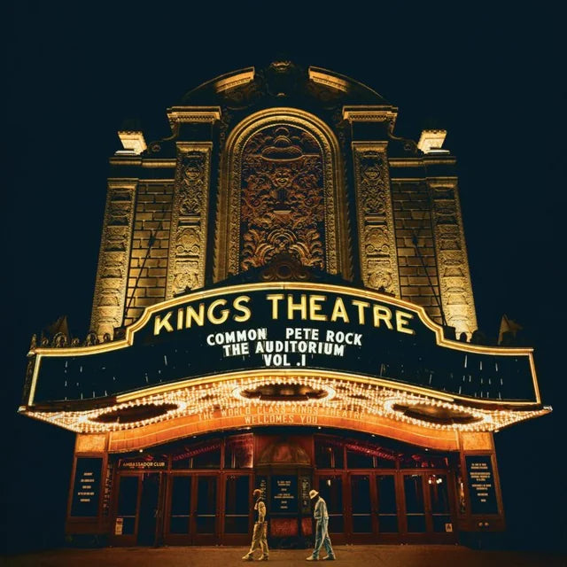 Nighttime photo of a theater marquee displaying “Common & Pete Rock” album art.
