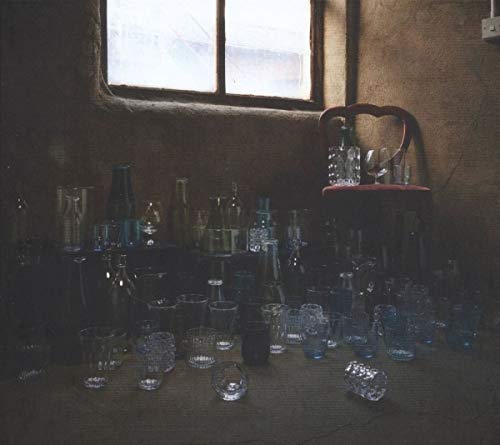 Compilation AUS100 CD cover with a still life of glass bottles and glasses.