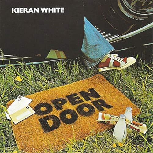 CD cover with a grass scene, shoes, and a "OPEN DOOR" mat.