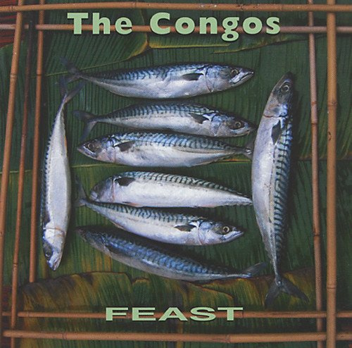 The image shows a vinyl record cover with seven fish on a bamboo grill.