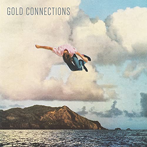 Vinyl record cover: person jumping against a cloudy sky and landscape.