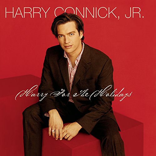 "Album cover featuring Harry Connick Jr. sitting on a red chair, wearing a black suit."