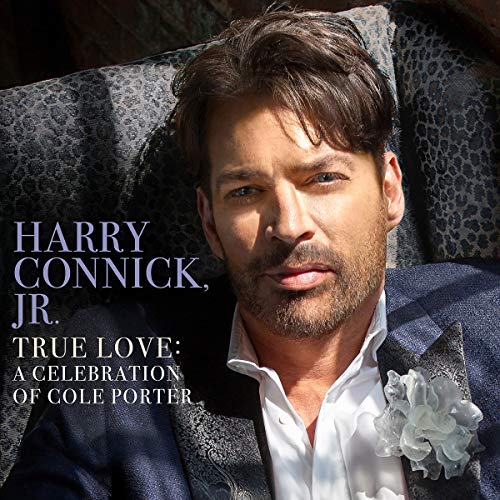 "Harry Connick Jr. album cover with man in suit on patterned couch."