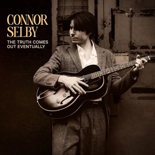 Man with guitar in suit, album cover for Connor Selby.