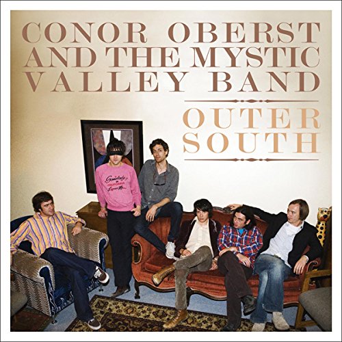 Conor Oberst and the Mystic Valley Band posing in a room for album cover.