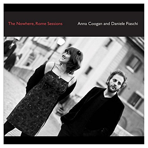 "Album cover with black-and-white photo of a man and woman in dark clothing."