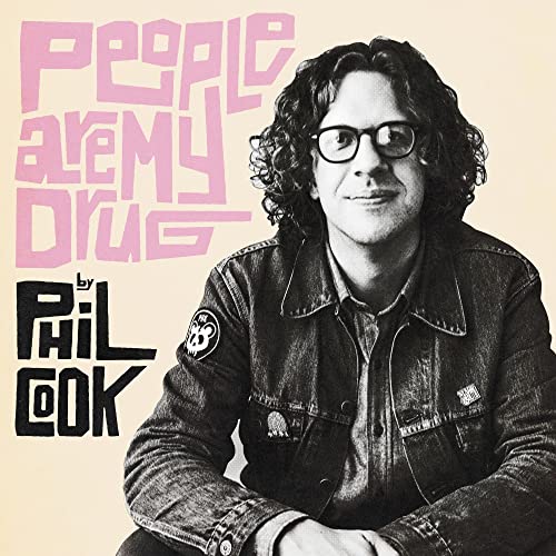 CD cover: Portrait of Phil Cook with pink text on beige background.