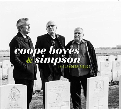 "Black and white album cover with three men standing among war graves."