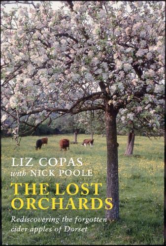Book cover with blossoming apple tree and cows grazing in a field.