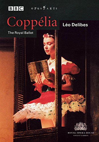 DVD cover featuring a ballerina in a red dress holding a book in a window.
