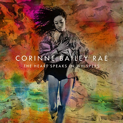 Corinne Bailey Rae stands against a colorful, textured background on this album cover.