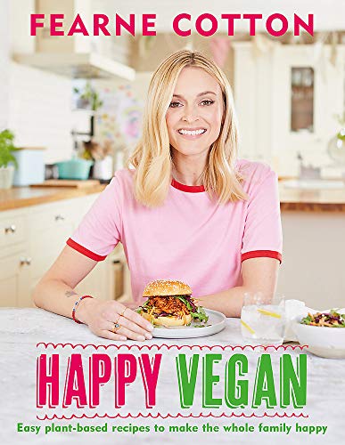 Cookbook cover featuring Fearne Cotton holding a vegan burger in a kitchen.