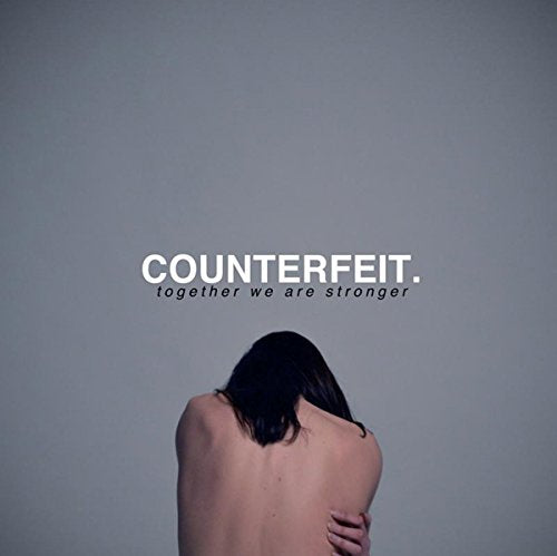 A shirtless person with dark hair, arms crossed, against a grey background with text overlay.