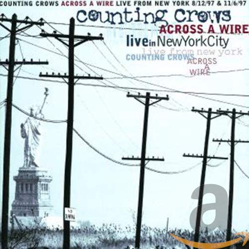 Counting Crows “Across a Wire” CD cover with power lines and Statue of Liberty.