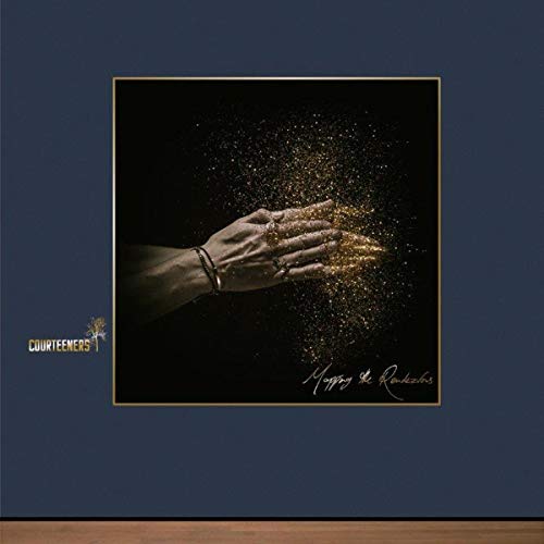 Hands clapping together with gold glitter falling against a dark background.