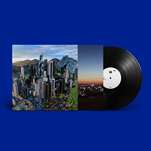 Vinyl record with album art depicting a city and mountains.
