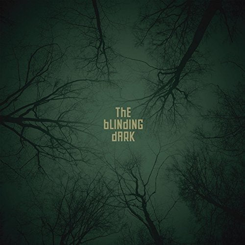 Album cover showing dark tree branches against a green sky with centered text.