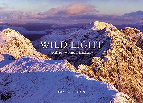 Snow-covered Scottish mountains at sunrise, book cover titled “Wild Light.”