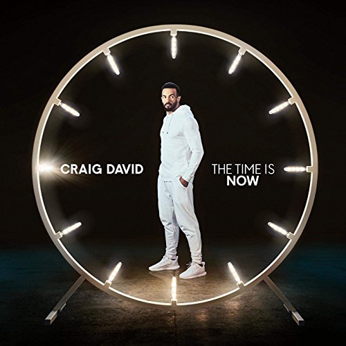 Craig David stands inside a large clock face, album cover art.