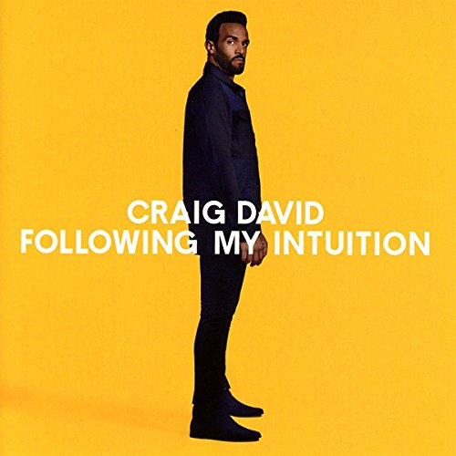Craig David album cover, yellow background, artist standing in profile, text centered.