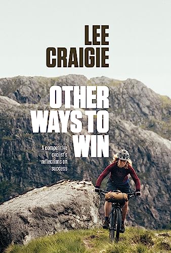 Book cover: cyclist riding uphill with mountains in the background.