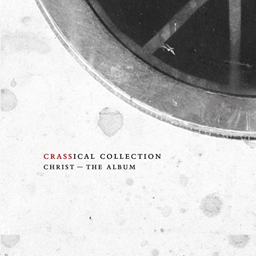 "Album cover with a black vinyl record and red and black text on a white background."