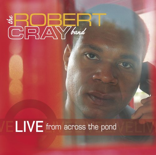 Robert Cray album cover, portrait of musician with red and gold background.
