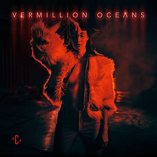 CD cover: woman with orange fur, dark background, red text.