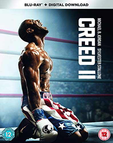 Blu-ray cover of Creed II featuring a shirtless boxer kneeling in a ring.