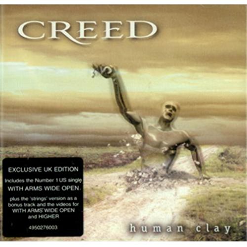 Creed’s “Human Clay” CD cover with a clay figure in a field.