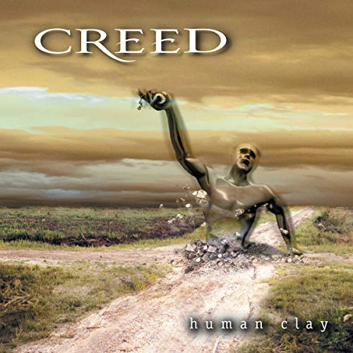 Album cover for Creed’s “Human Clay” featuring a fragmented, rising figure.