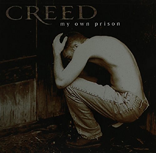CD cover for Creed’s “My Own Prison” featuring a man in distress.