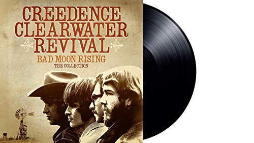 Album cover for Creedence Clearwater Revival featuring band members and a black vinyl record.