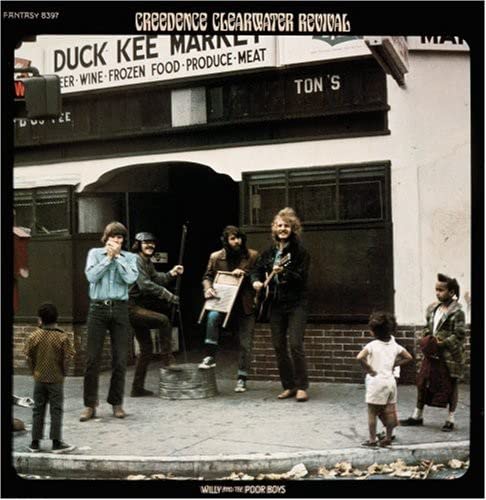 Creedence Clearwater Revival album cover: band standing in front of a market.